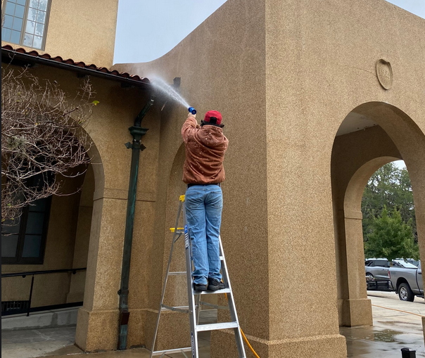 Soft washing service - low-pressure soft wash on building exterior in Shreveport